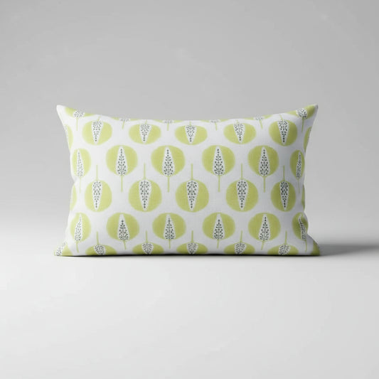 Decorative pillow with green and white pattern on a gray background